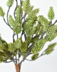 Faux green pinecone bush showing the bare stem base that drops into a pot