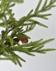 Artificial Norfolk pine stem showing soft green needles and wired branches