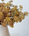 Faux beige sedum bundles in a vase showing depth of beige color