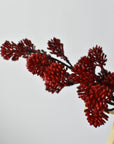 Faux red sedum bundle showing round, soft-edged berries clustered along the stem