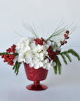 White Hydrangea + Greens in Red Glass Container