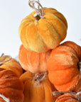 Goldenrod and orange velvet pumpkins for a Thanksgiving table