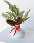 11" Faux Hemloch Stems w/Pinecones in Container with Red Velvet Bow