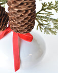 11" Faux Iced + Glittered Cypress Stems w/Pinecones in Container with Red Velvet Bow