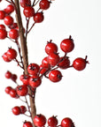 Faux red berry spray with branches that cut apart for garlands