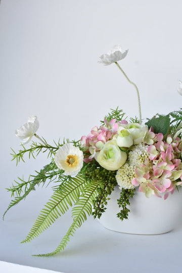 Soft Pink Spring Arrangement in White Boat Container
