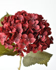 Close-up of a 7-inch deep burgundy faux hydrangea bloom showing individual florets