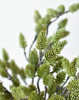 Artificial green pinecone bush from the side showing its five wired stems