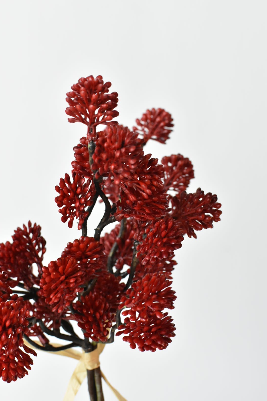 Single faux red sedum bundle of 3 stems tied with raffia