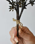 Three wired stems of faux dark brown and green sedum held together as one bundle