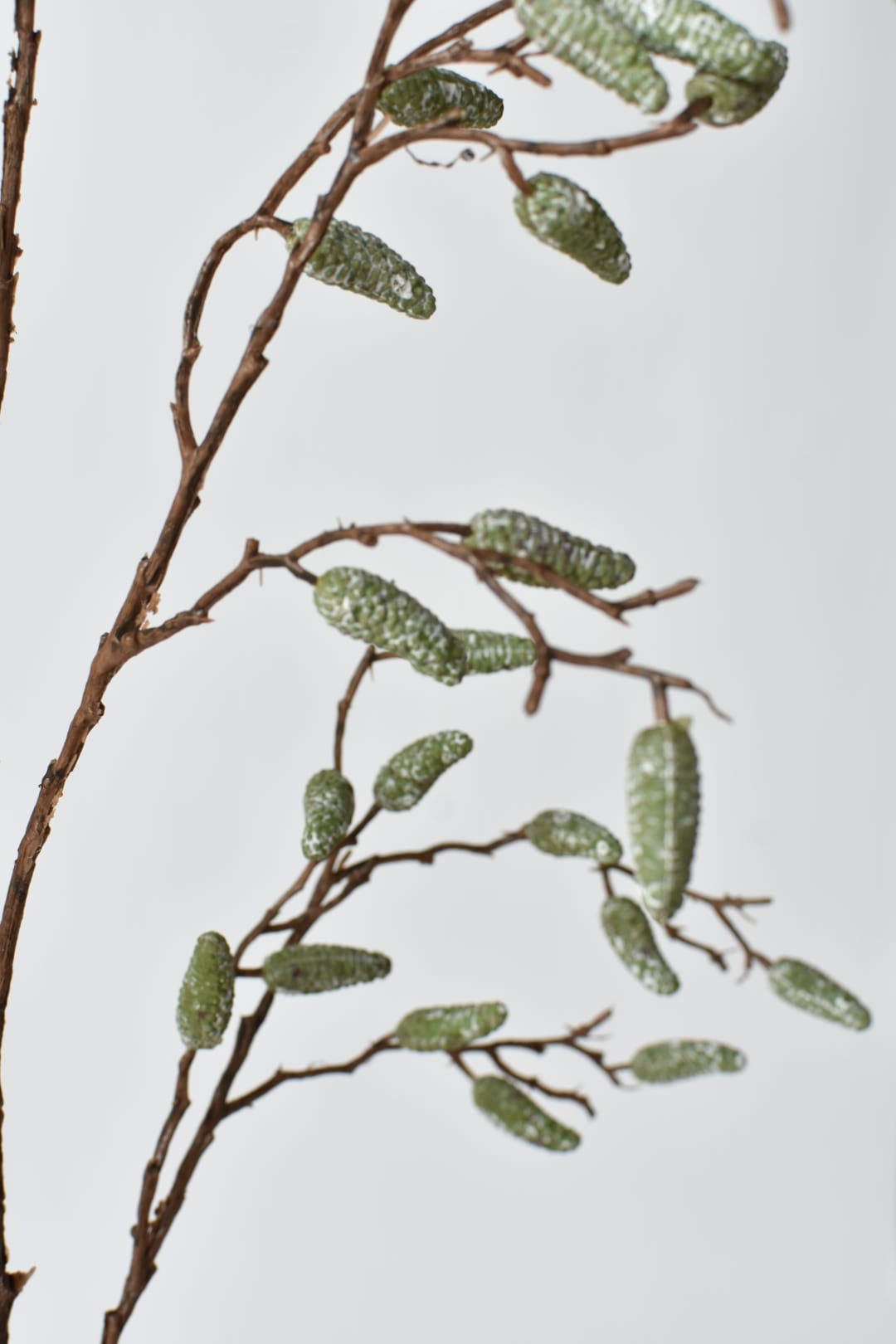 35 inch faux pod spray branch stem viewed from a second angle