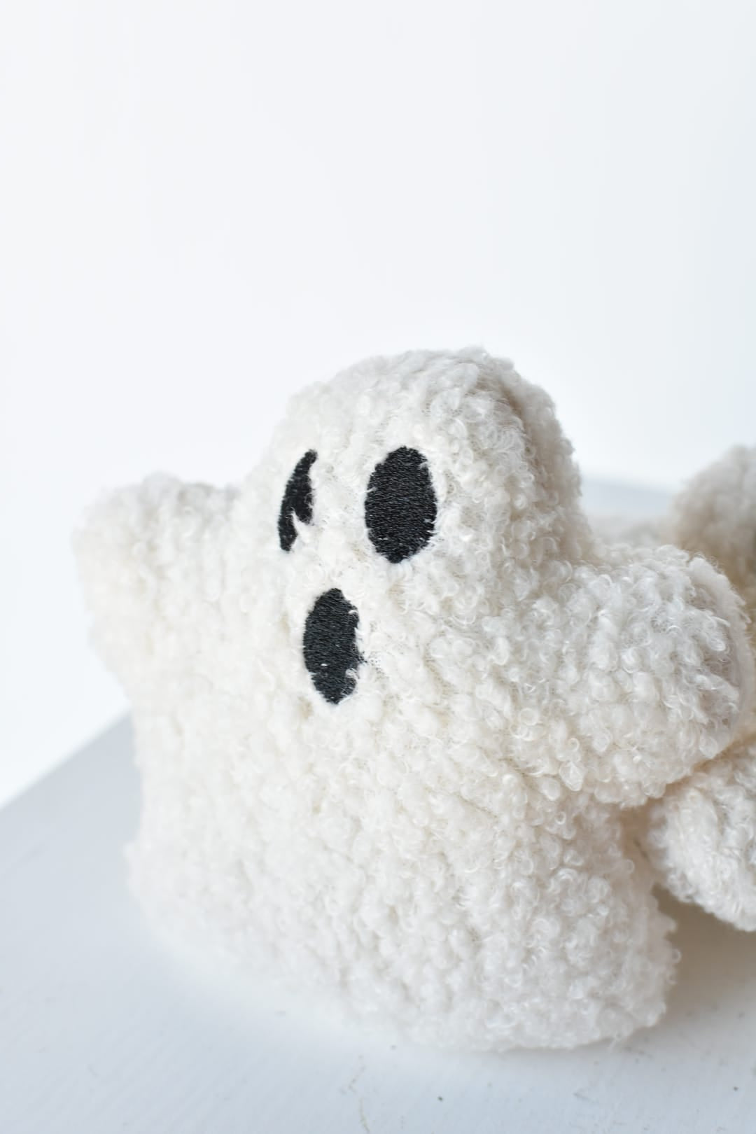 White boucle ghost plush measuring 4.5 inches wide for tiered tray decor