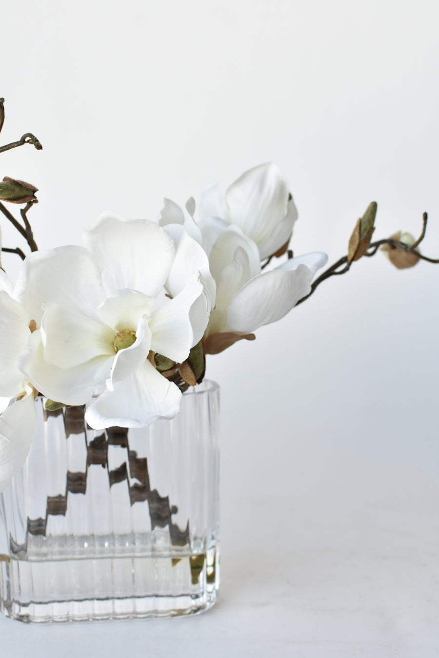 Slim White Magnolia in Reeded Glass Arrangement