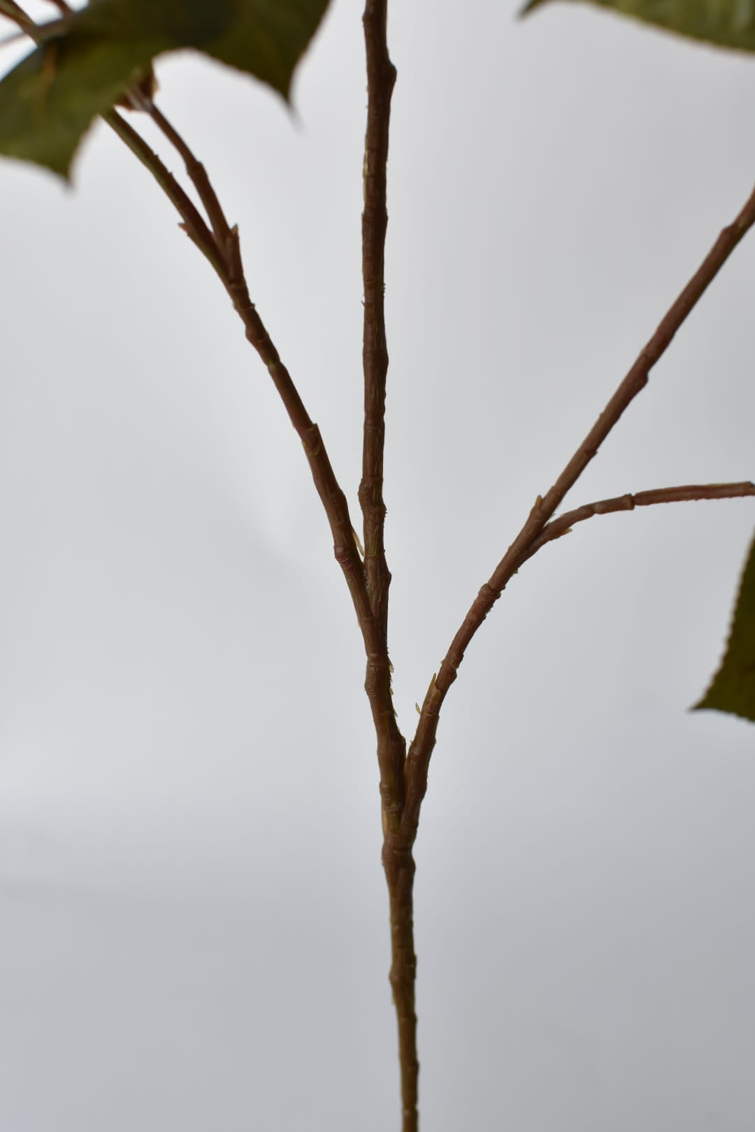 Green and brown faux fall foliage stem, sold by the stem