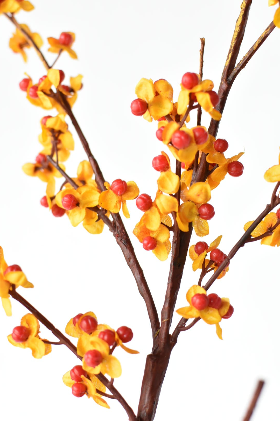 Faux bittersweet branch with hard plastic berries and poly silk blooms