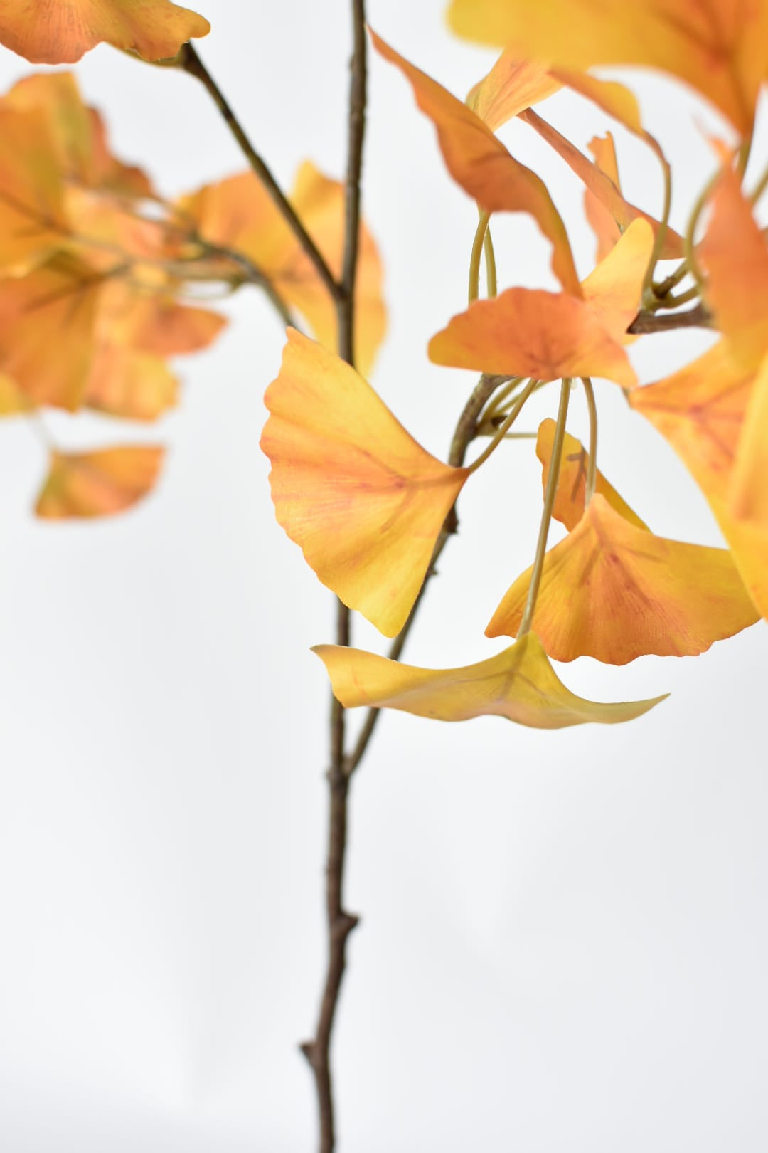 Tall faux fall foliage stem that splits at 21.5 inches from the base