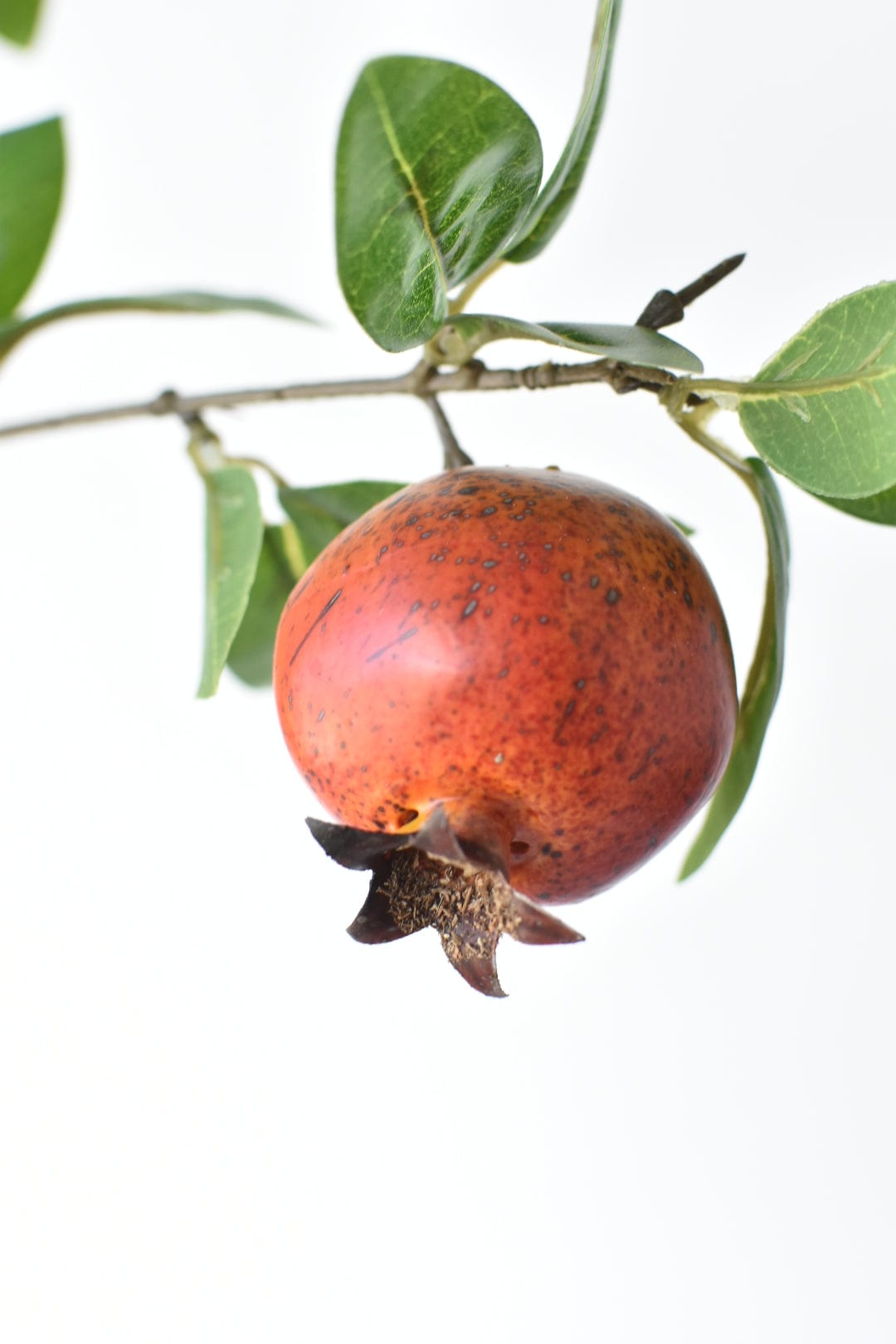 Artificial pomegranate branch with 3 to 4 inch hand-finished fruit on wired plastic stems