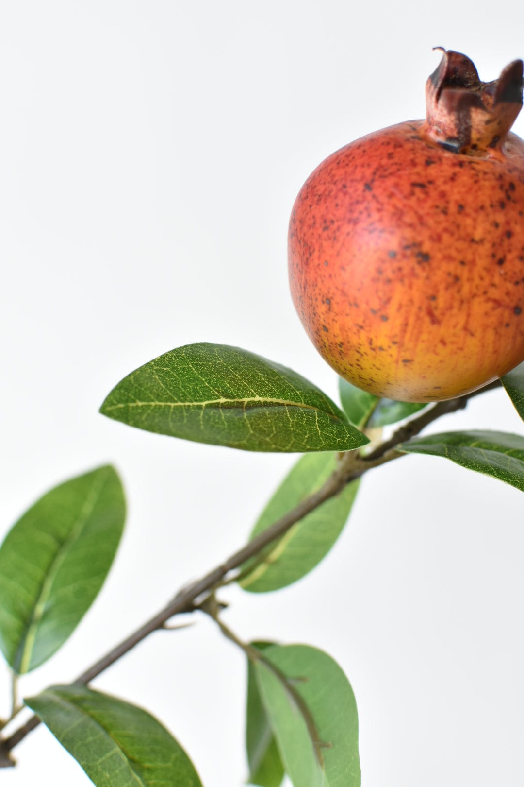 Faux pomegranate stem that splits at 17 inches to fit a tall vase or urn