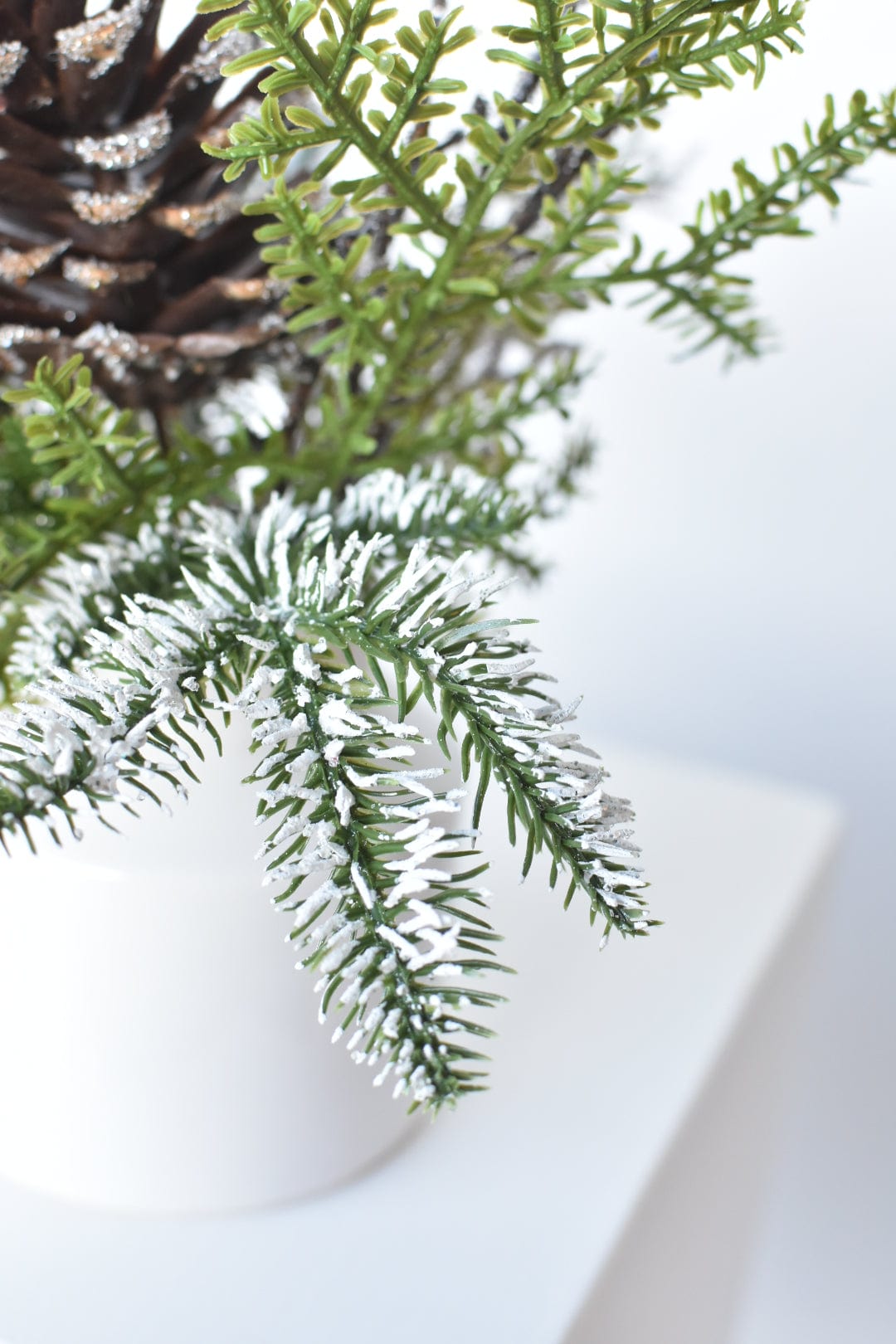 13" Iced Pinecone and Pine in White Ceramic Vase