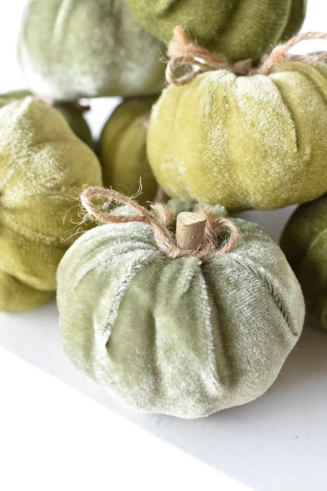 Green velvet pumpkins in three shades, three of each color
