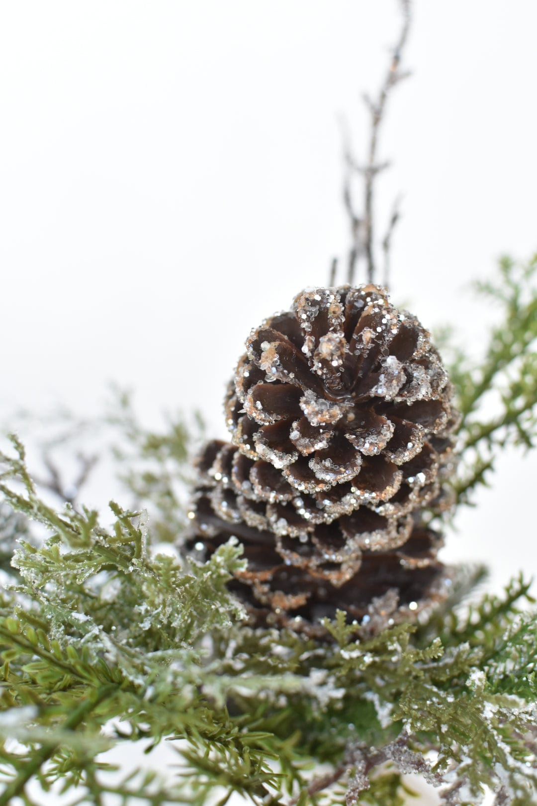 13" Iced Pinecone and Pine in White Ceramic Vase