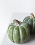 Mini resin pumpkin figure measuring 2.5 inches tall and wide