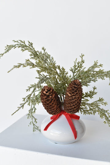 11" Faux Iced + Glittered Cypress Stems w/Pinecones in Container with Red Velvet Bow