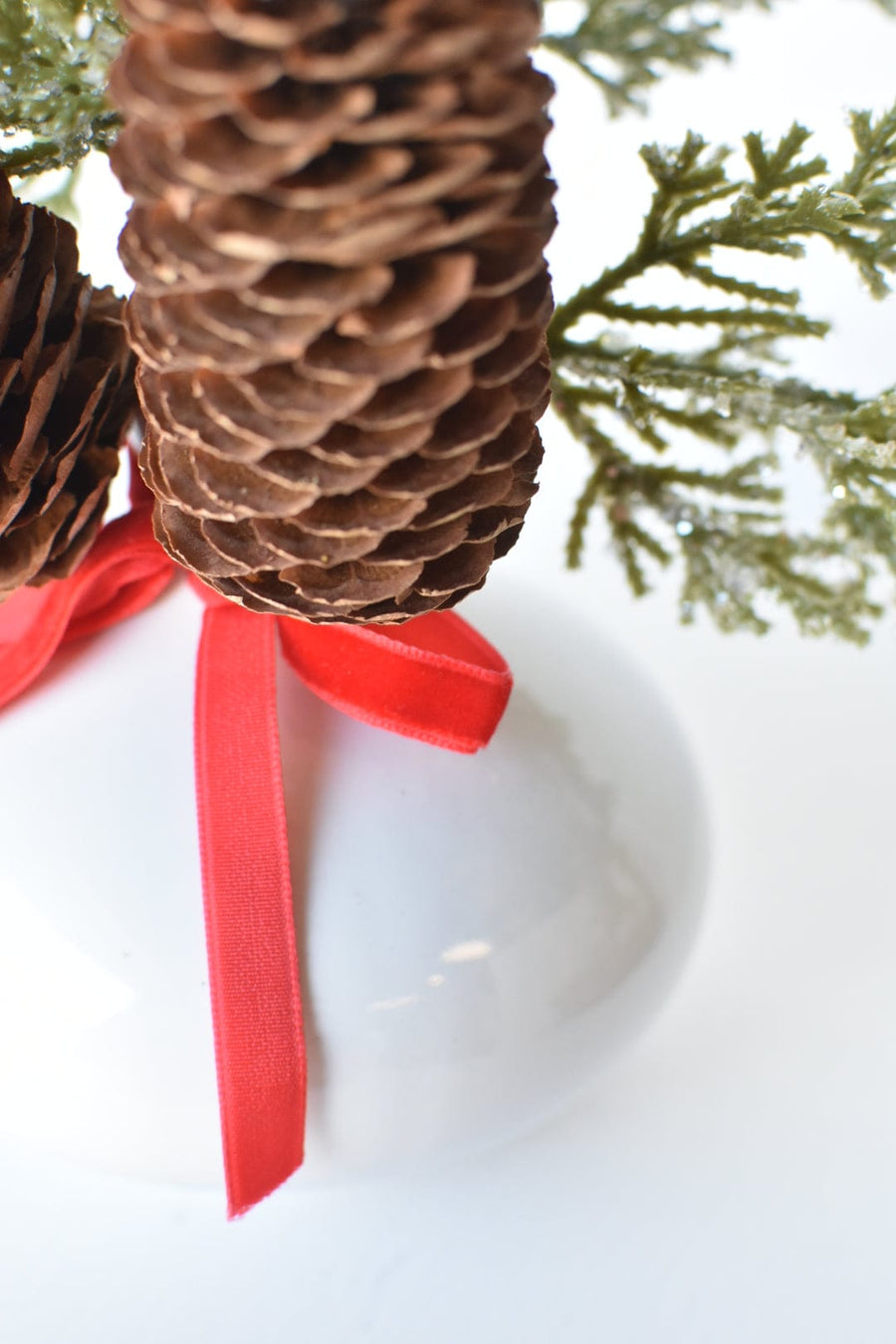 11" Faux Iced + Glittered Cypress Stems w/Pinecones in Container with Red Velvet Bow