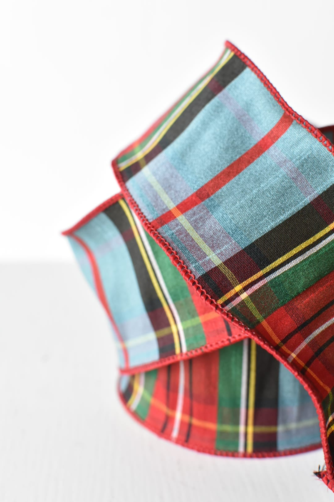 Light blue plaid ribbon showing the woven pattern and wired edges
