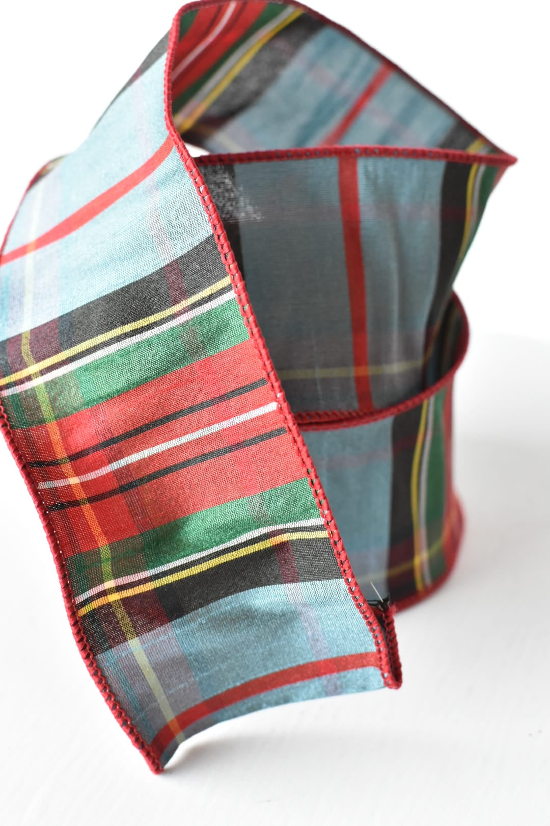 Close view of woven light blue plaid on faux dupioni ribbon