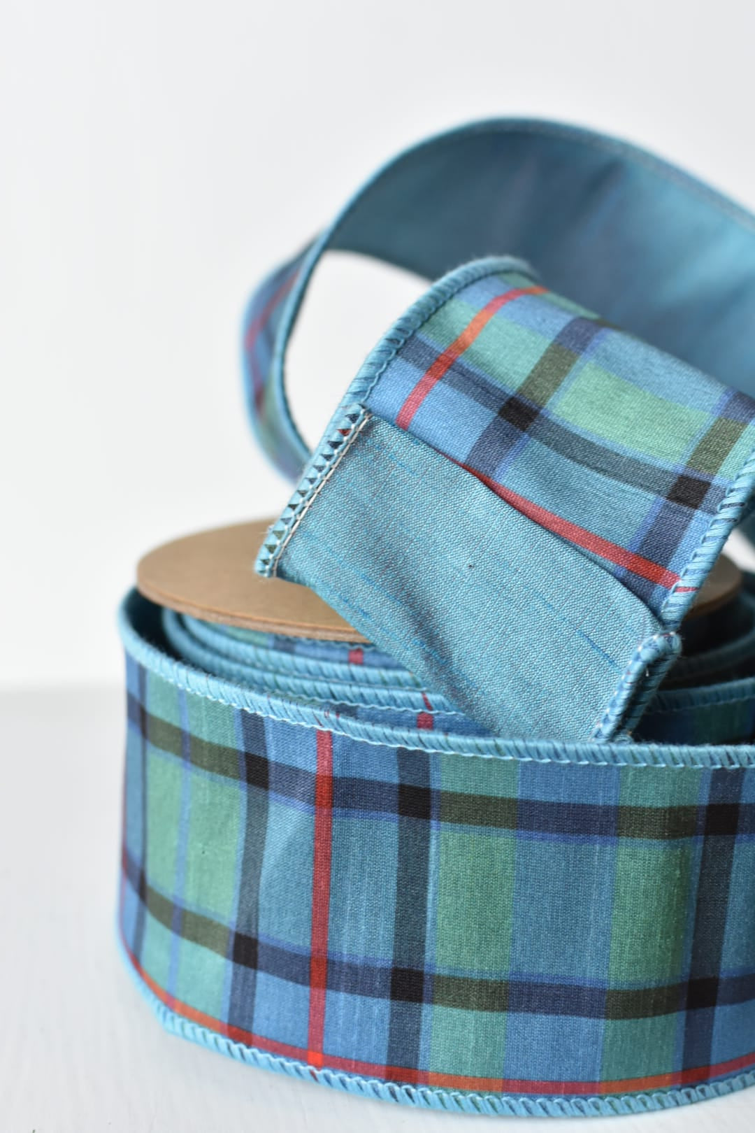 Light blue plaid ribbon showing the woven pattern and wired edges