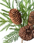 Close-up of faux Norfolk pine and cedar greenery on a wired bush
