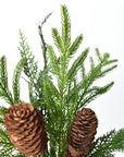 Real pine cones in mixed sizes tucked into artificial pine branches