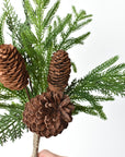 Mixed faux evergreen bush with natural pine cones for Christmas decor