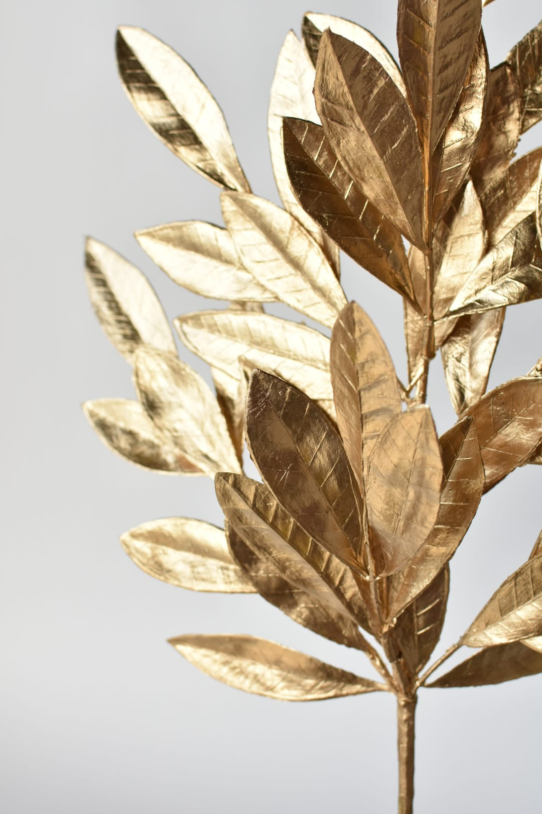 Artificial gold bay leaves in a warm metallic finish with no glitter