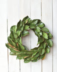 Real Touch faux magnolia wreath showing layered green leaves and full round shape