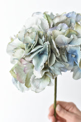 Faux blue, green, and lavender hydrangea bundle of three stems in a small vase