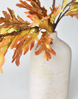 Faux oak leaf branch in warm autumn colors