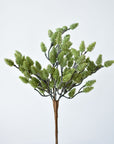 Green faux pinecones in detail showing the molded plastic color and cone texture